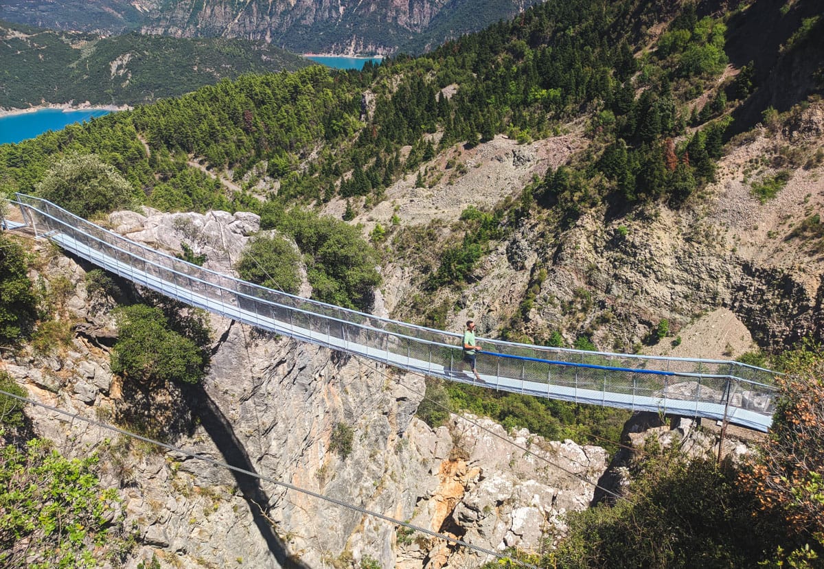 Crossing the cliff and the bridge leading to Agia Deutera Psilovrachou. In the background, part of Lake Kremasta can be seen.